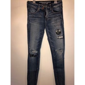 Dark wash American eagle graphic ripped denim